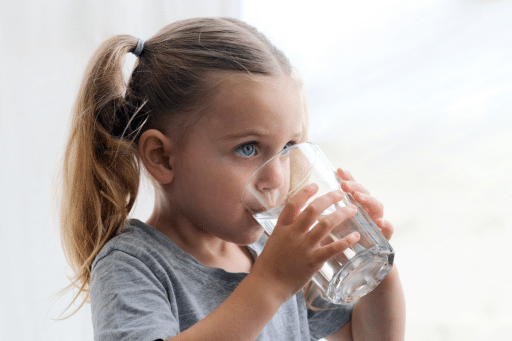 Little girl drinking water